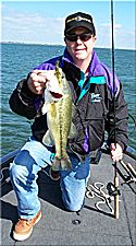 Tom Lester II, with a Lake Richland - Chambers fall bass caught on a Strike King Wild Thang, Quarrow Dream Catcher signature series 5 Power Worm Rod, 4/0 Gamakatsu EWG hook and 15# P-Line CXX under a boat dock.