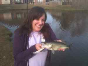 Jessie and her first baitcaster bass!