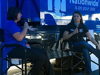 Danica answers questions under the blue top of Nationwide