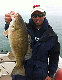 Guide Frank DiMarcantonio with a quality Lake Erie smallmouth tricked by a Keitech Fat Swinging Impact.