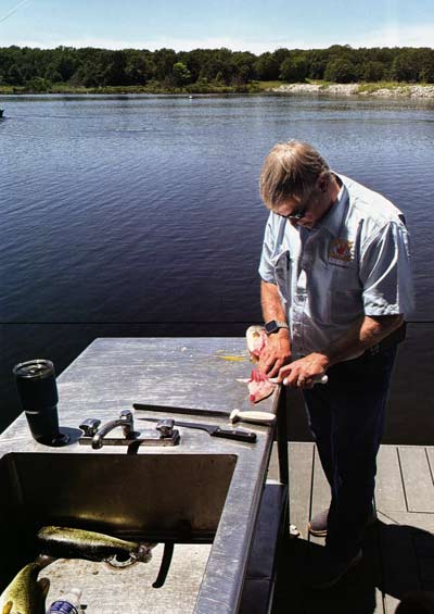 A good way to harvest excess bass. Here, Bobby West sets the stage for fish tacos after determining they needed to harvest some bass.