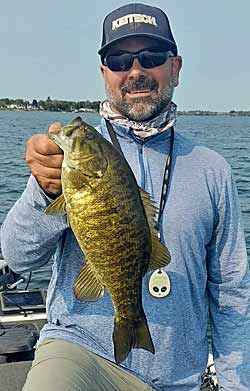 Guide Mike Cusano looks for prespawn bass in natural lakes around transitions in bottom composition, such as muck to gravel, and drop offs along the edge of flats. Photo courtesy of Mike Cusano