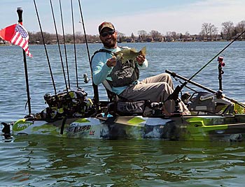 Mike McKinstry considers his rod holder — mounted next to his seat — the most important accessory on his kayak. Without decks, it’s the only place to put his rod while changing lures, retying a knot or posing with his catch. Photo courtesy of Mike McKinstry