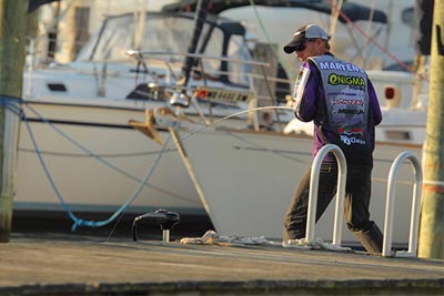 Bass use marinas outside the spawning season, as Aaron Martens proved when he won the Bassmaster Elite Series tournament on the Chesapeake Bay in August 2015. Accurate casts are key to catching them regardless of season. Photo courtesy of B.A.S.S. / Seigo Saito