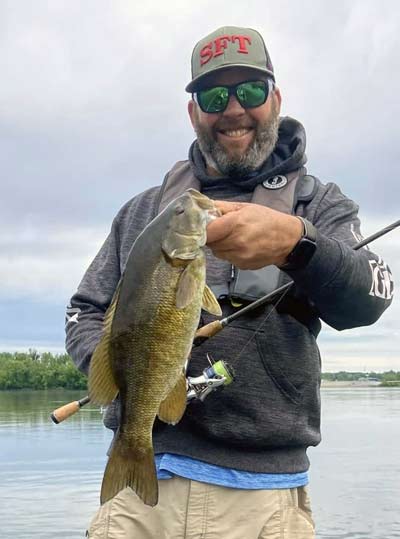 Mike Acord knows the southern stretch of Pennsylvania’s portion of the Susquehanna River and its smallmouth like the back of his hand. And when summer rolls around, he said the best places to catch smallmouth from moving water are shallow flats, behind ledges, and in front of obstructions. Photo courtesy of Mike Acord