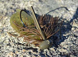 Tungsten football jigs’ sensitivity gives anglers a better feel. Whether it’s the scratching of sand or bangs of rock, using one makes it easier to uncover deep-water spots that attract bass. Photo by Pete M. Anderson
