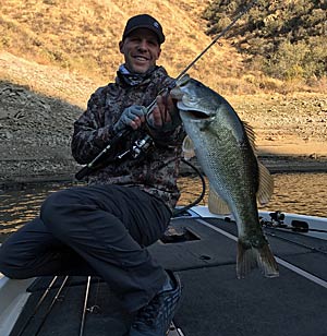 Aaron with hisCastaic bass caught with Rhino Head and Aaron's Magic.