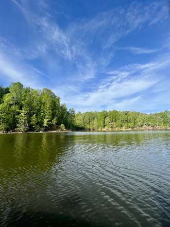 A protected backwater will naturally warm up faster, making it a great place to begin your search for active bass.