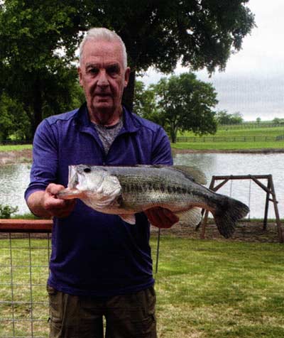 Tim Kennedy with a nice bass caught and released (of course he did) in April. Bass help control the overpopulation of bluegills. But it's a balancing act, so to speak