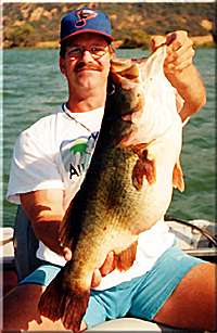 Dee Cowgill of Winters, California holds a 13lb 2oz bass caught at Clear Lake on September 8, 1999.