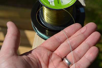 Braided line is better for pitching. This 50-pound test braid coils less than the 25-pound test monofilament and has a smaller diameter. Both help it leave the reel smoothly and easily travel through a rod's line guides. Photo by Pete M. Anderson