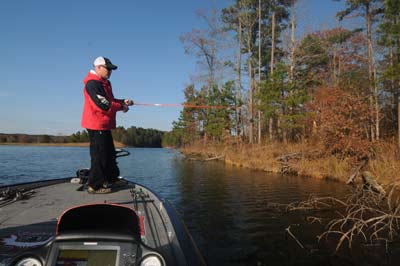 Chad Morgenthaler notices flats with isolated laydown logs are ideal restocking spots for bass on lowland reservoirs.