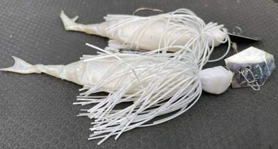 When trying to imitate shad, a white ChatterBait and a matching soft plastic trailer is one of the best ways to do it, and you can fish them quickly to get the attention of bass feeding on spawning shad.