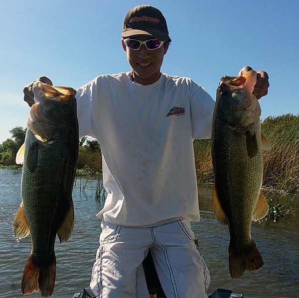 Forum member bmlum415 with a 10- and 8-pound bass from the California Delta.
