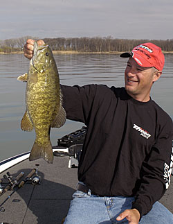 Bass guide Gerry Gostenik knows exactly when smallmouth are going to invade the shallows and be susceptible to suspending jerk baits.