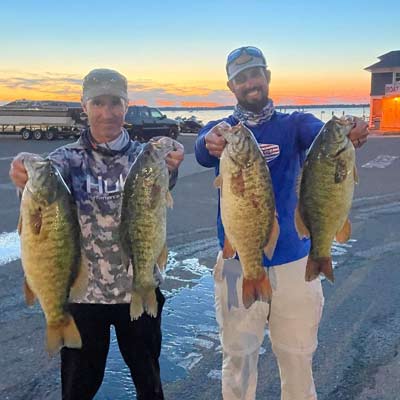 Smallmouth are on the move in early summer, swimming to their summer haunts from shallow spawning spots. Lake Erie bass guide Destin DeMarion, pictured on the right, said the key to catching more of them is understanding where they’re headed and how they’ll get there. Photo courtesy of Destin DeMarion