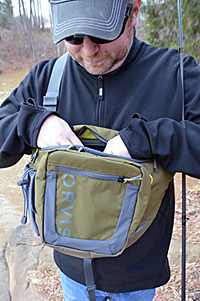 Sling packs were designed for fly fishing, but they work well for carrying conventional tackle, too. There’s room for a few boxes of hard baits, a couple bags of soft plastics and special sleeves for clippers and a bottle of water.  Photo by Pete M. Anderson