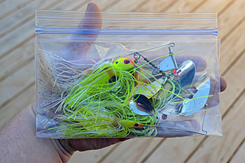 Lay spinnerbaits and buzzbaits in a resealable freezer-type plastic bag. They take up less room this way. Remember to open the bag when you return home so they can dry. Photo by Pete M. Anderson