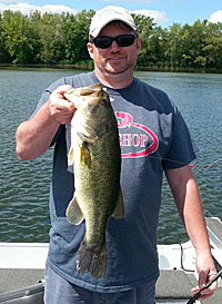 Lures designed to catch large fish, such as musky glide baits, also catch big bass. This fish hit a 7-inch glide bait worked over submerged milfoil. Photo by Pete Anderson