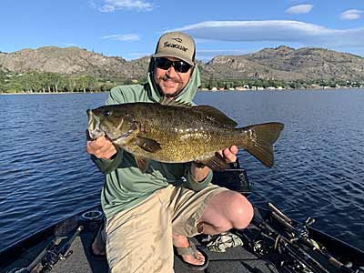 The author with a big post-spawn smallmouth that ate a small 3/32-ounce hair jig.