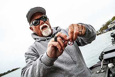McDonald joins a braided line to a fluorocarbon leader.
