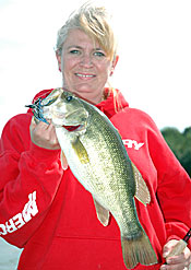 Shortening up and pitching a jig into cover close to the boat paid big dividends for Lynne Petersen.