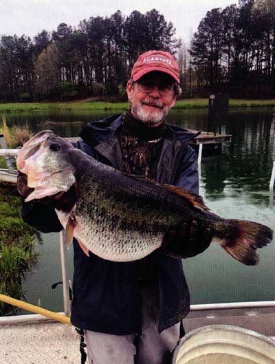 Mac Barnes at Sanctuary Timber and Wildlife with one of many 11-pound-plus Florida Strain Largemouth bass grown on the property.