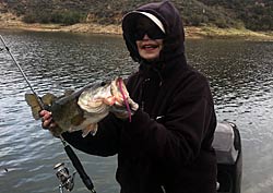 Liz Jones with a big Castaic bass caught with Texas rig on Morning Dawn. Notice the bullet weight just left of her reel?