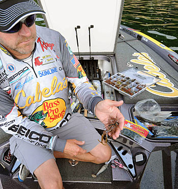 Mike McClelland beefs up his football jig with a large soft plastic trailer to entice hungry postspawn bass.