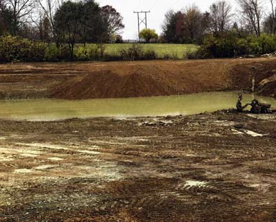 In the far corner of the dam, Corser had a peninsula built. It was a less expensive way to spoil extra dirt from making the lake deeper, plus it will become a fun place to enjoy that end of the lake. 