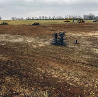 Another peninsula along the edge, creating more shoreline. Notice the long shelf to the right and some woody structure staged along the edge to be used near the end of the project.