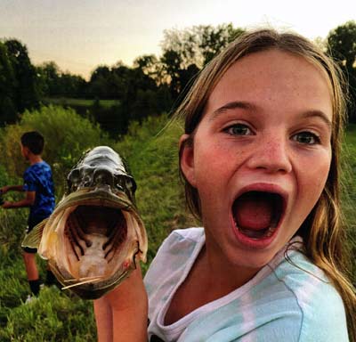 The Corser girls already enjoy catching some fish.