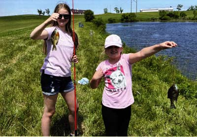 Girls are cutting their teeth catching bluegills.