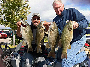 Mark Zona and Jerry McKinnis holding up some of the quality smallmouth caught in the rivers of Michigan. Photo Credit:  Zona’s Awesome Fishing Show