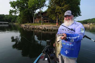 A rocky bank is a favorite spot for Dion Hibdon to target bass feasting on spawning shad. 