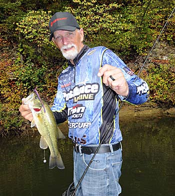 Harold Stark can catch multiple bass from a single log, presenting his drop-shot rig in clear, shallow water.