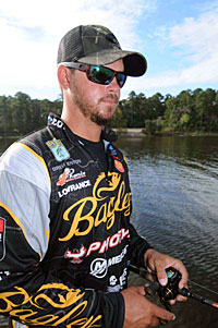 Drew Benton relies on a good pair of sunglasses for locating and studying bass on spawning beds.