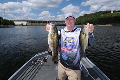 The author and Missouri guide Jack Uxa caught mostly spotted bass (left) and largemouth bass (right) on a late summer river trip. 