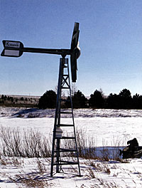 Figure 1. A Koender's windmill on a South Dakota pond during a "lovely" winter day. Note that the graduate student, rather than the professor, is in the boat.
