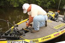 Before he can make a single cast today, Scroggins must first have all loose screws cinched-up by long-time Triton service technician Andy Stallings.
