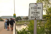 The sign says you can’t fish or dive from the Clinton Street Bridge, but …